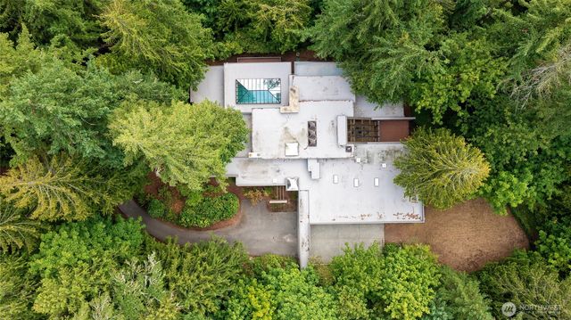 an aerial view of a house with a yard and garden