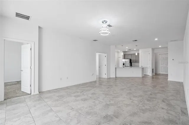 a view of a livingroom with a kitchen
