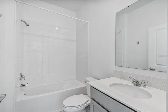 a bathroom with a toilet a sink and a bathtub