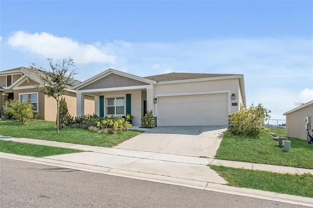 front view of a house with a yard