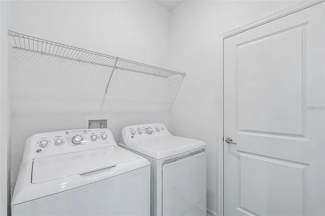 a utility room with dryer and washer