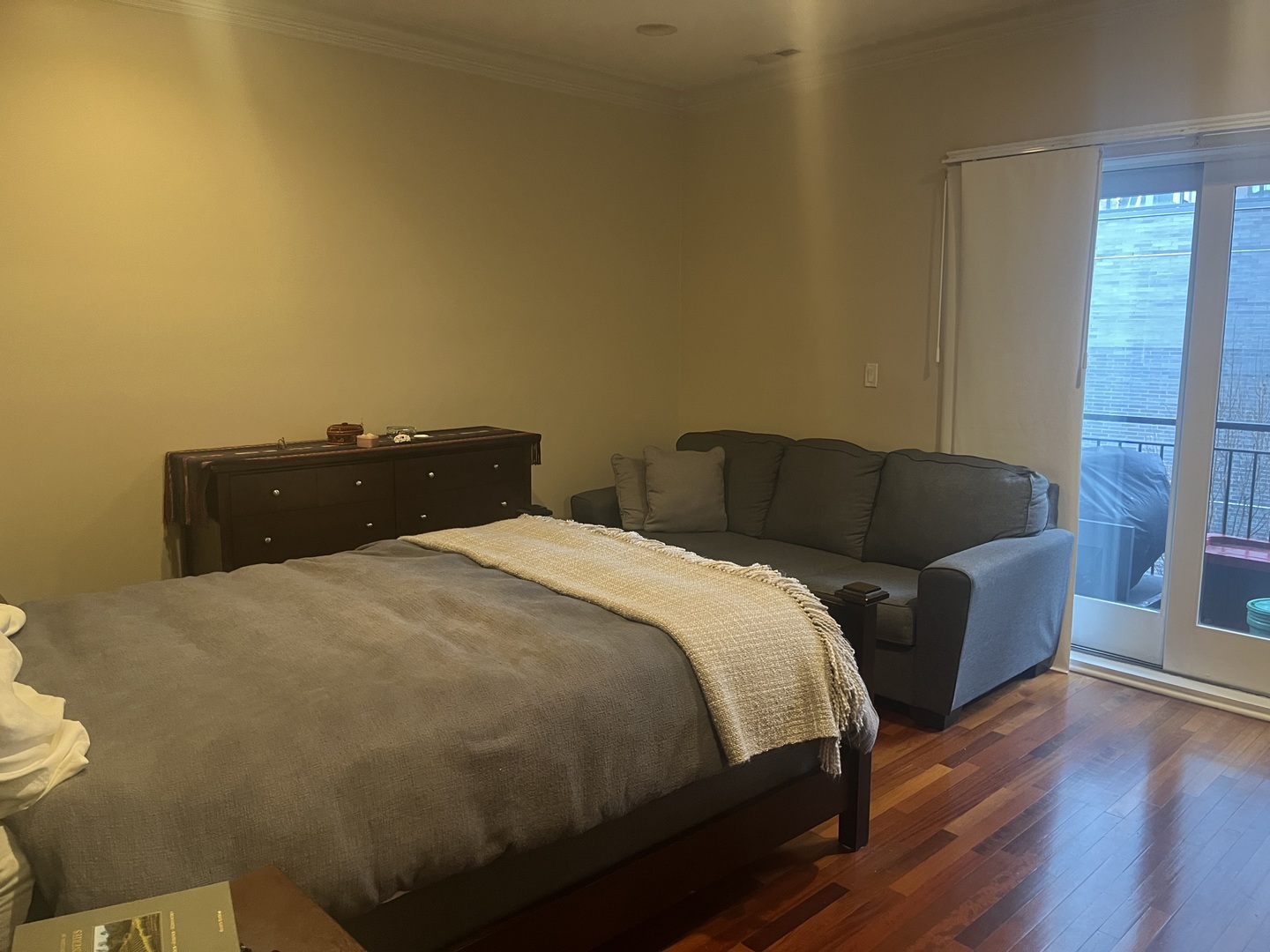 27 North Morgan Street, Unit 3 Chicago, IL 60607 - Photo 15 of 18 a bedroom with a bed and wooden floor