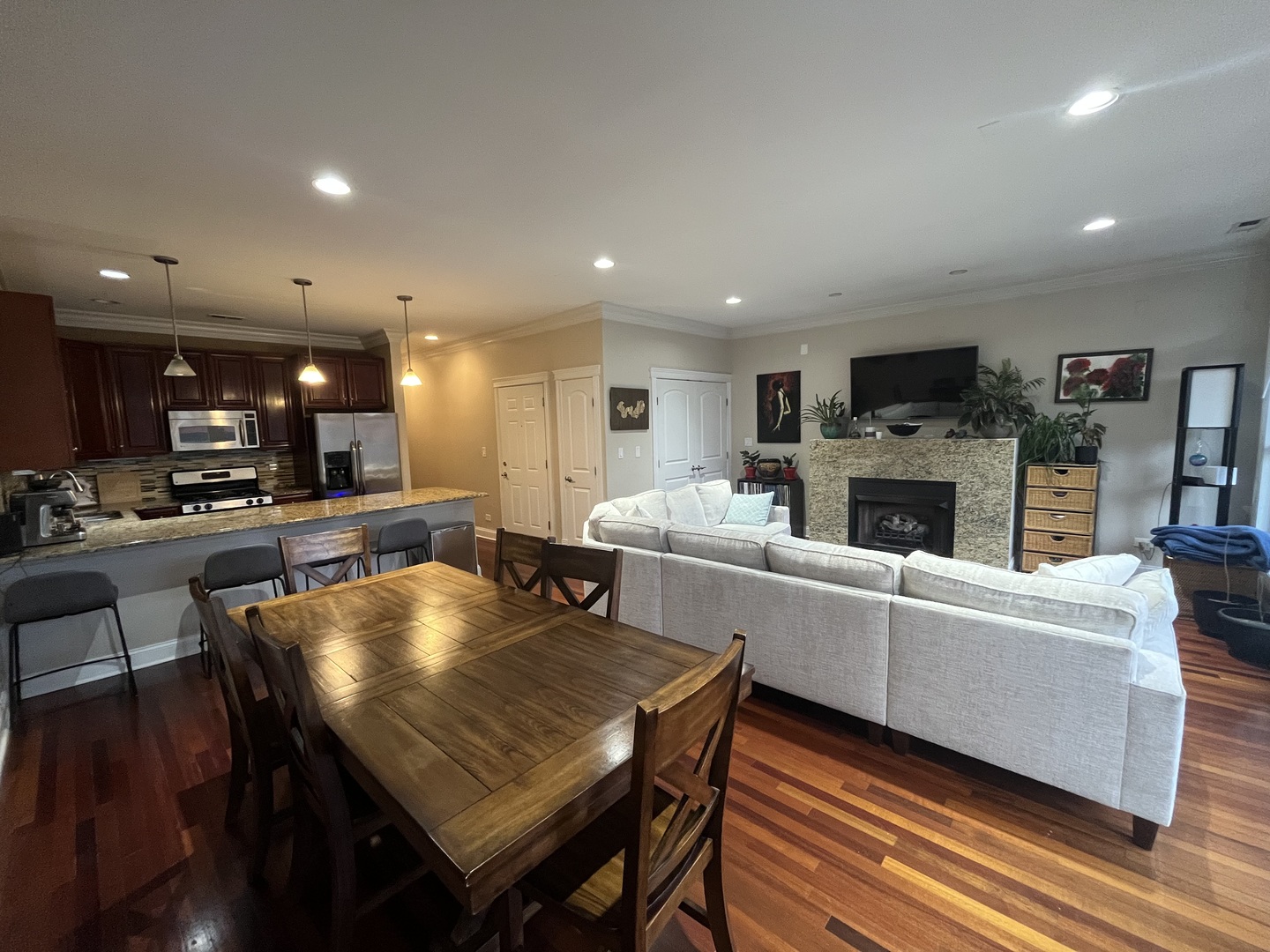27 North Morgan Street, Unit 3 Chicago, IL 60607 - Photo 5 of 18 a living room with fireplace furniture and a wooden floor
