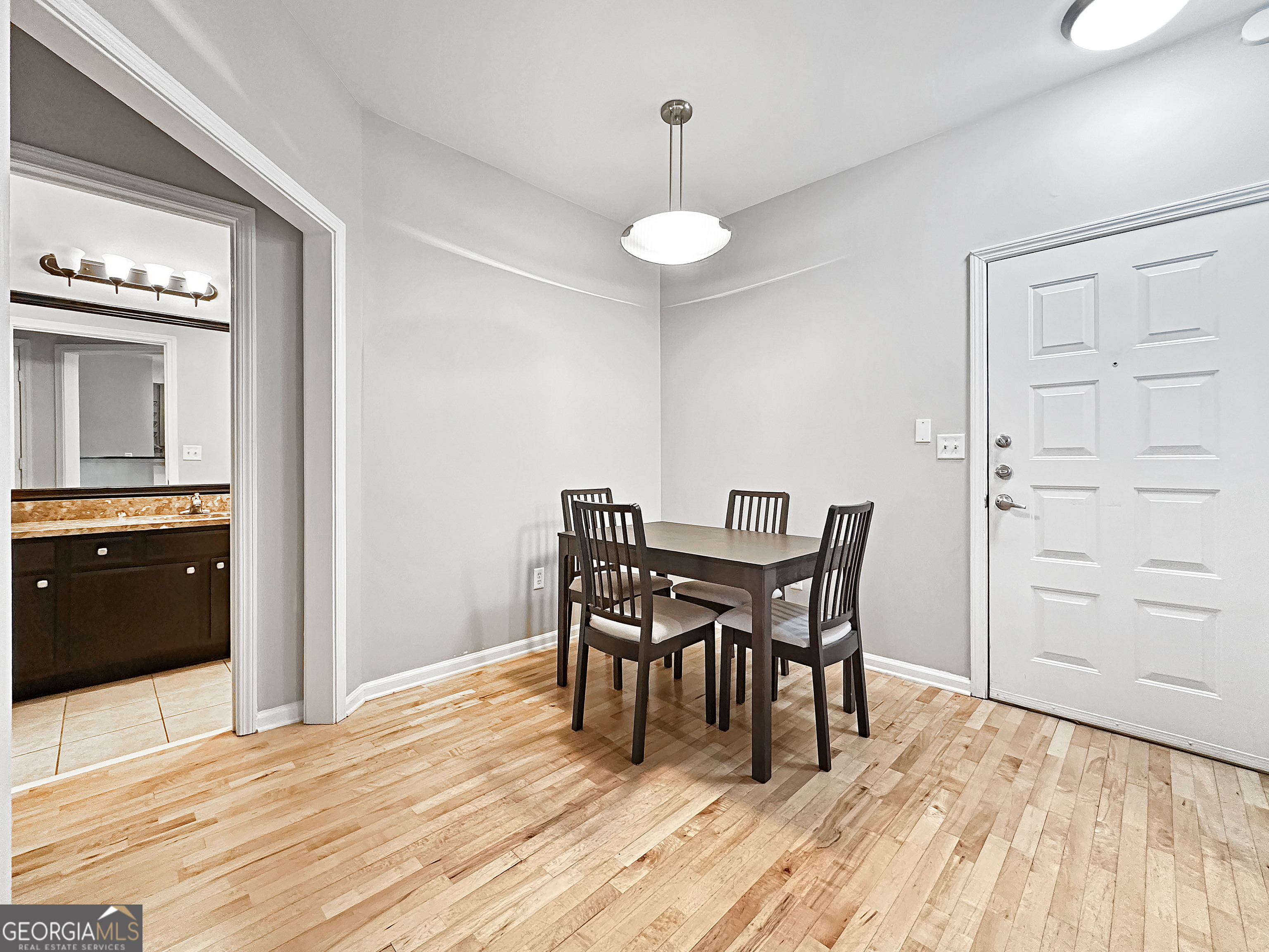 821 Ralph McGill Boulevard Northeast, Unit 3219 Atlanta, GA 30306 - Photo 6 of 12 a view of a dining room with furniture and wooden floor