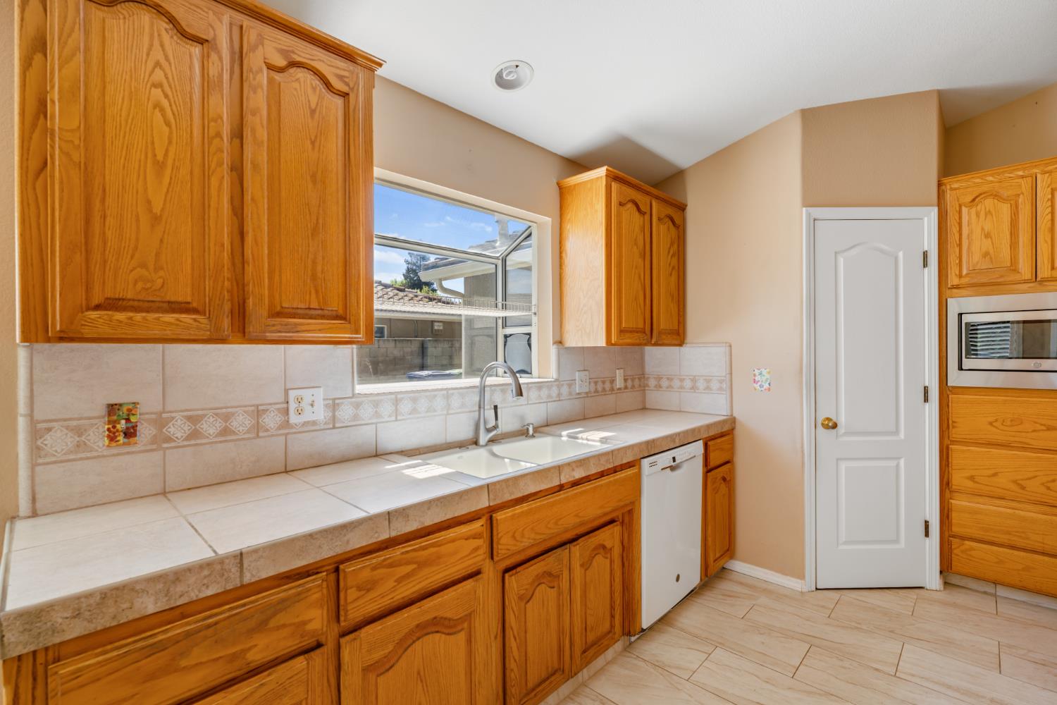 43 East Loop Madera, CA 93637 - Photo 17 of 49 a kitchen with a sink and cabinets