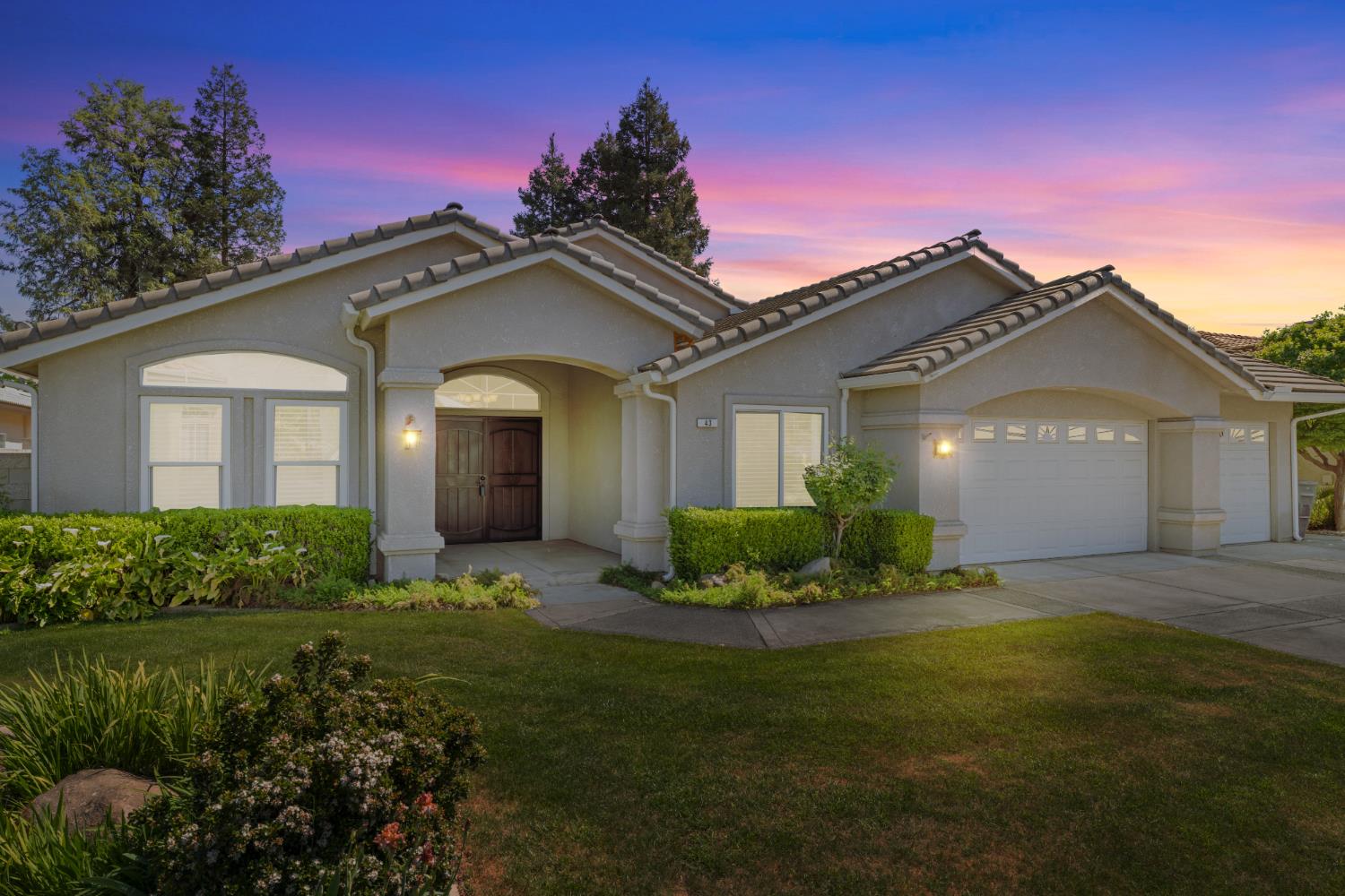 43 East Loop Madera, CA 93637 - Photo 2 of 49 a front view of a house with a yard