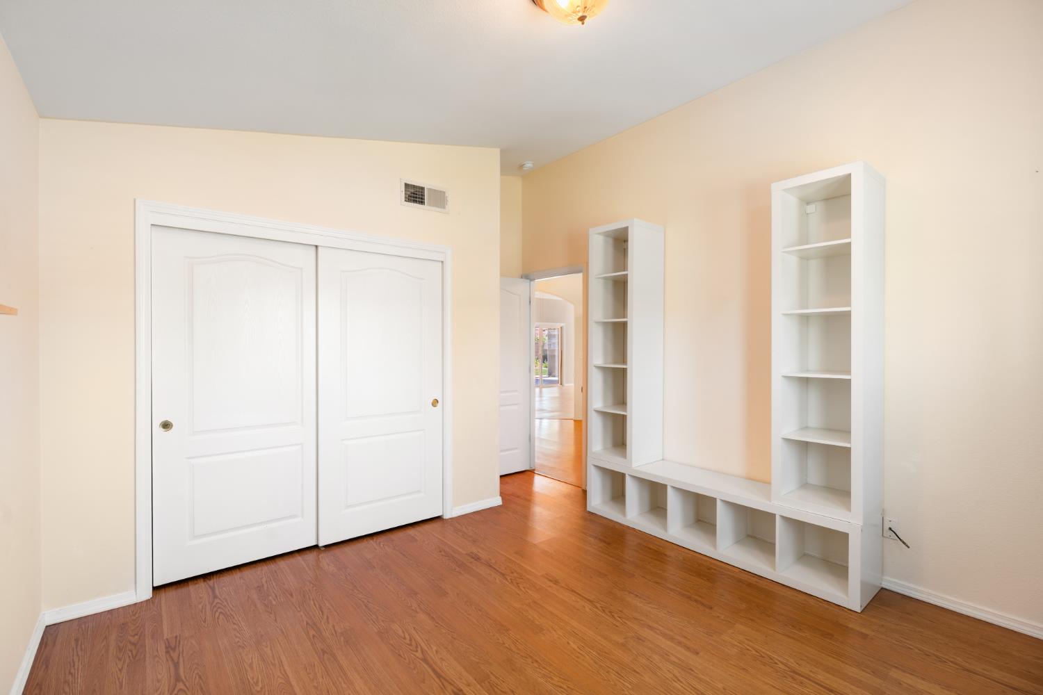 43 East Loop Madera, CA 93637 - Photo 25 of 49 a view of an empty room with wooden floor and closet