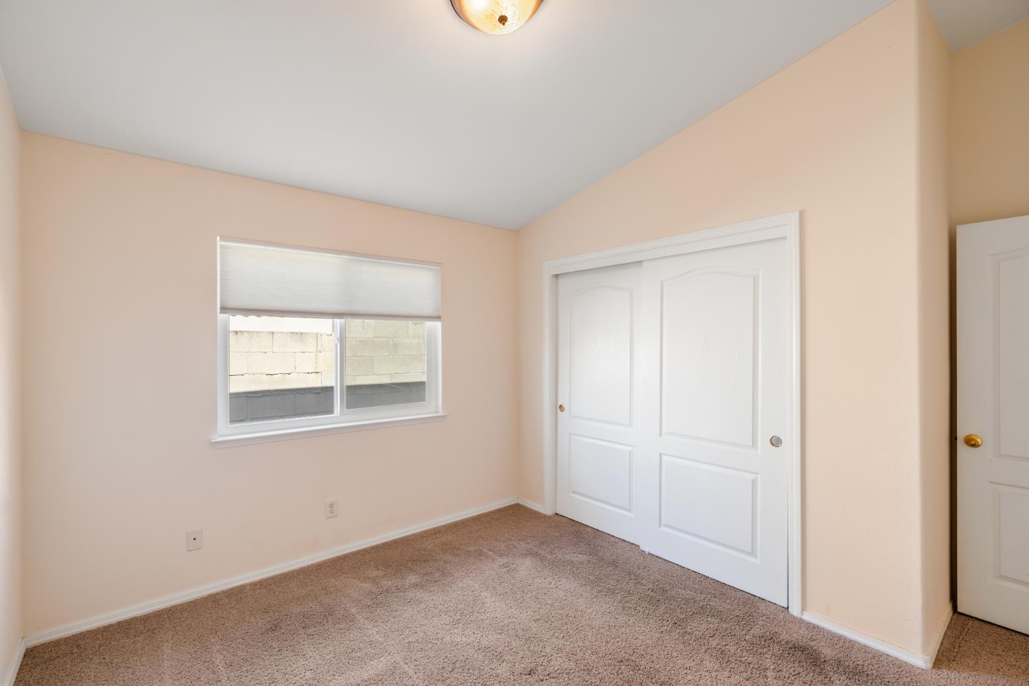 43 East Loop Madera, CA 93637 - Photo 28 of 49 an empty room with windows
