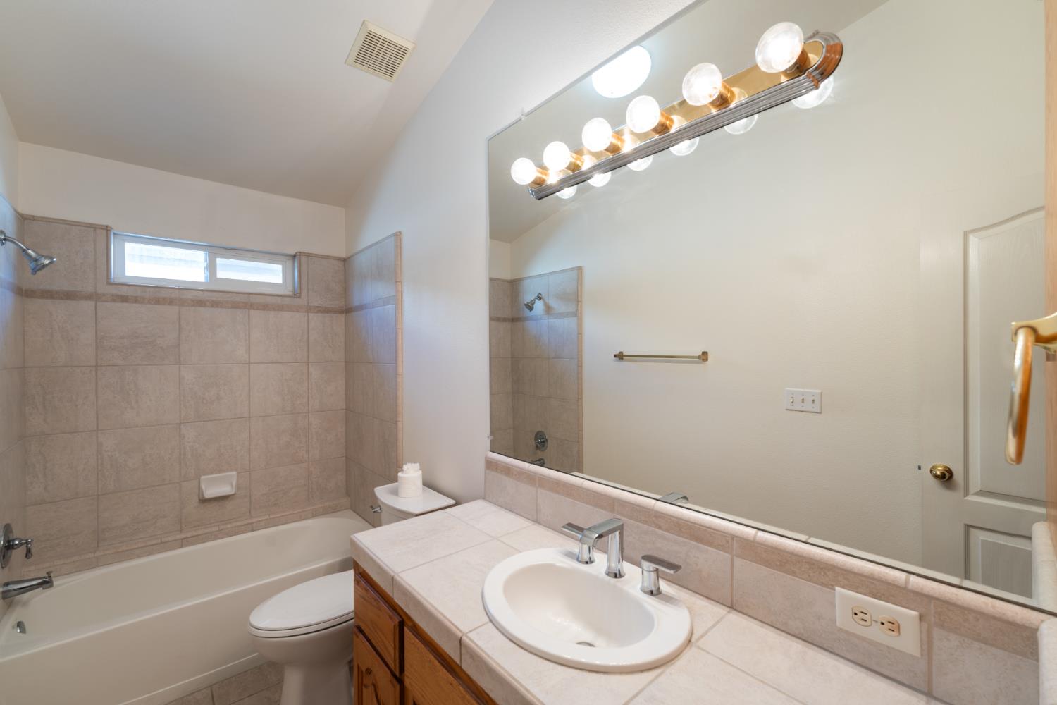 43 East Loop Madera, CA 93637 - Photo 29 of 49 a bathroom with a sink a toilet and shower