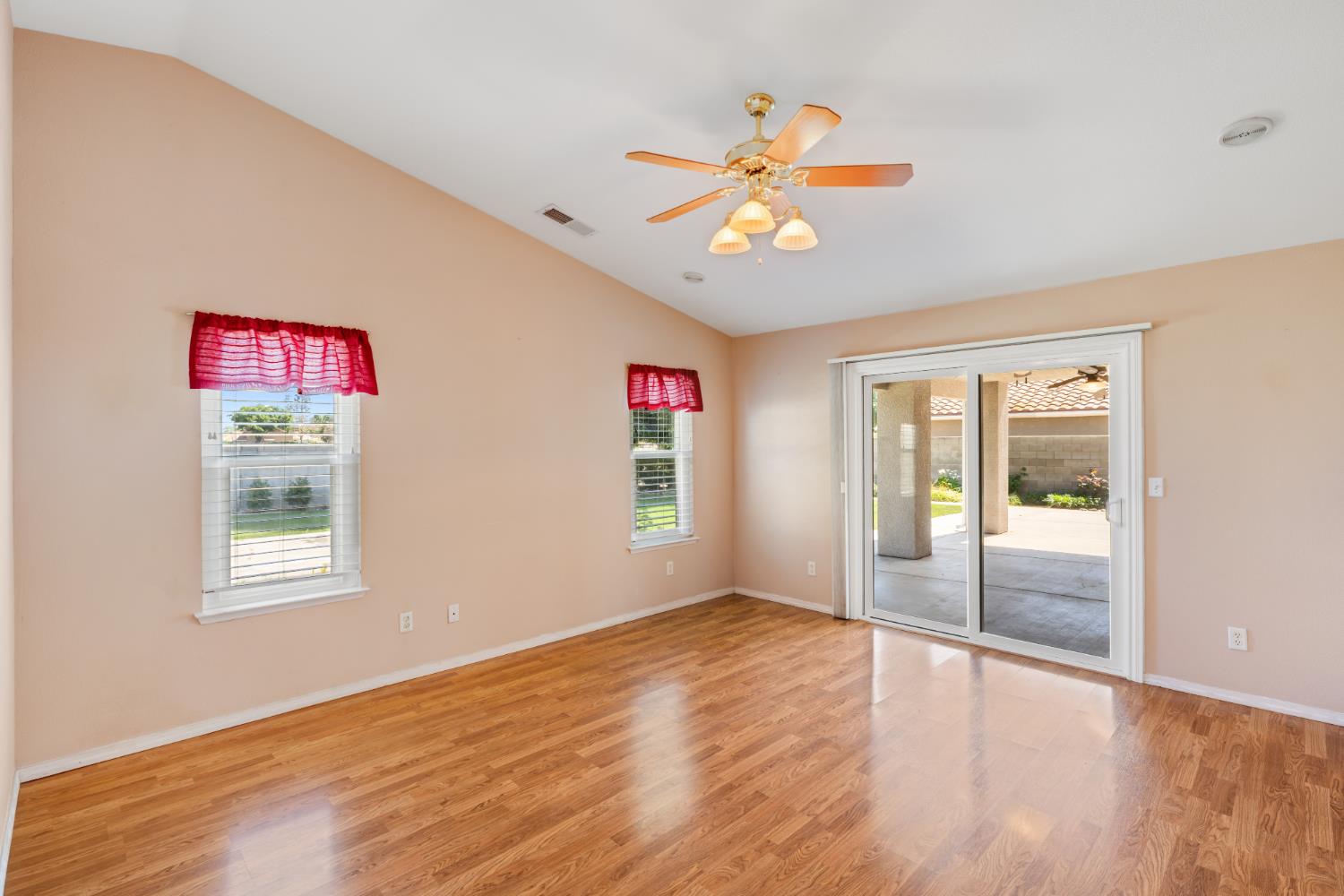 43 East Loop Madera, CA 93637 - Photo 30 of 49 an empty room with windows and ceiling fan