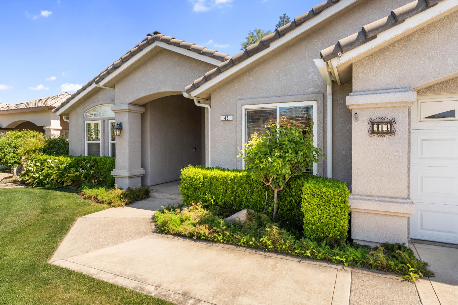 43 East Loop Madera, CA 93637 - Photo 5 of 49 a front view of a house with a yard