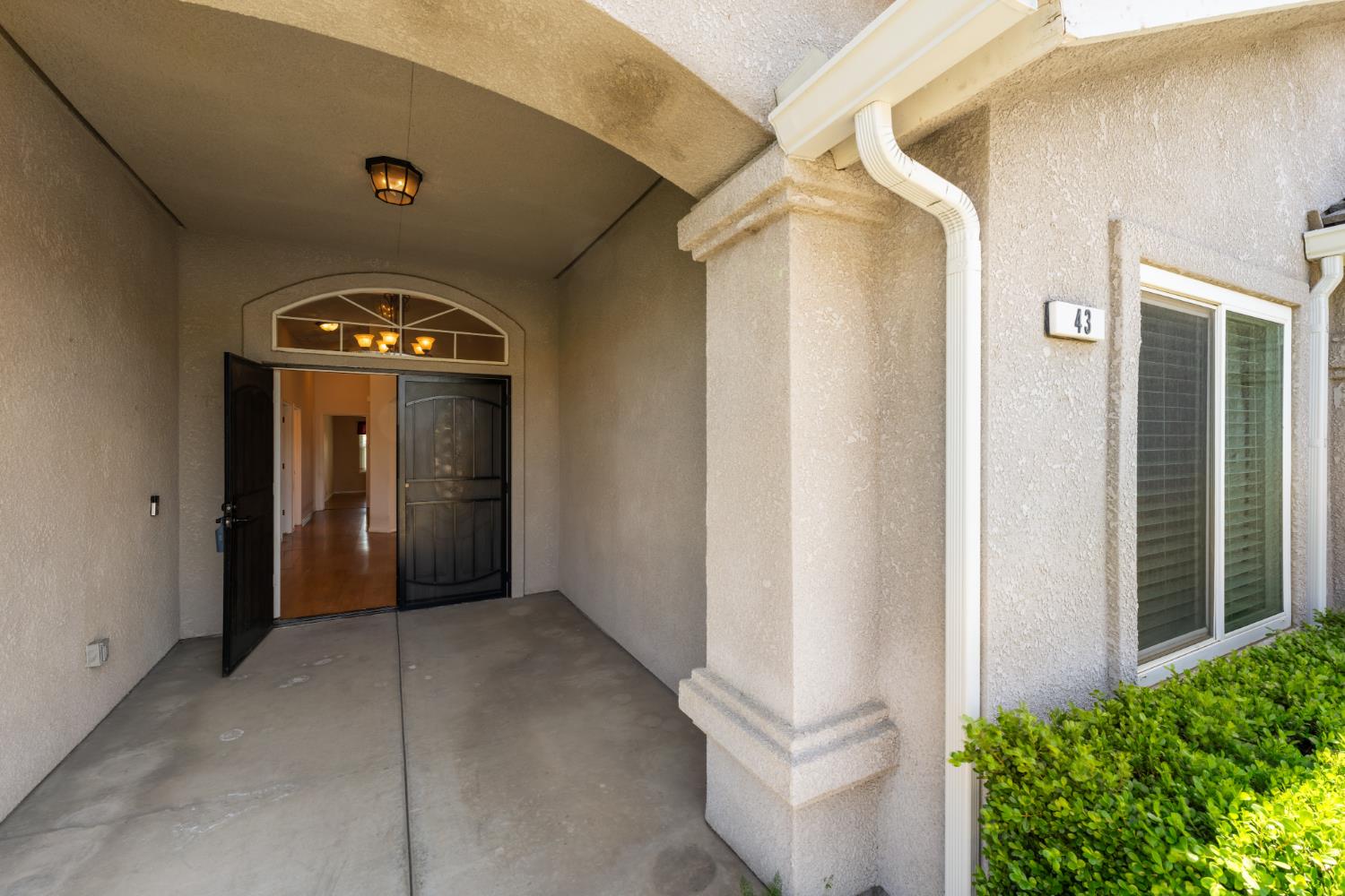 43 East Loop Madera, CA 93637 - Photo 8 of 49 a view of a hallway with wooden door
