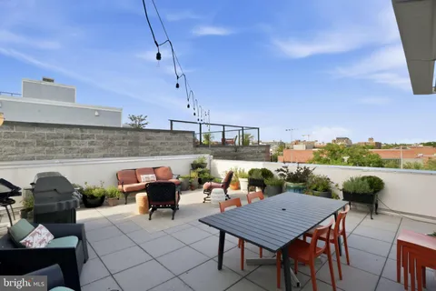 a terrace view with sitting space and seating space