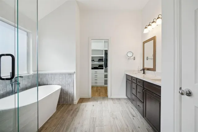 a bathroom with a bathtub and a shower