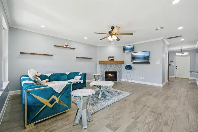 a living room with furniture a fireplace and a table