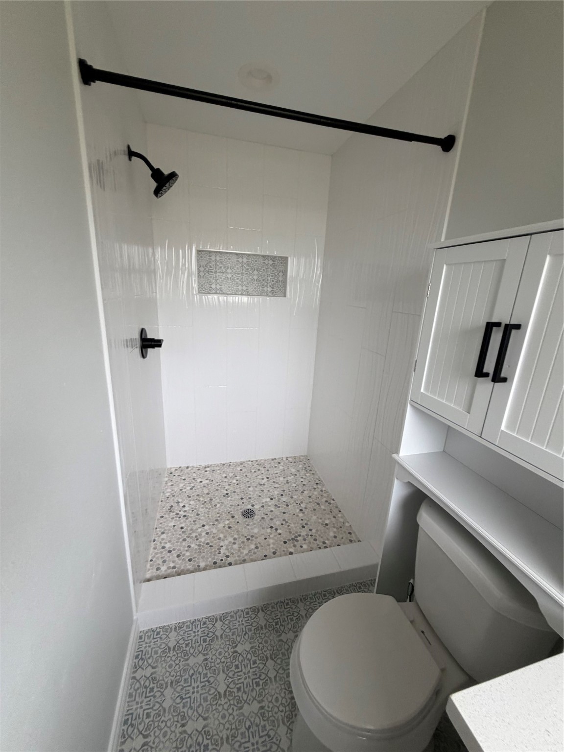 1920 Ripple Creek Drive Rosenberg, TX 77471 - Photo 22 of 26 a bathroom with a toilet and a shower