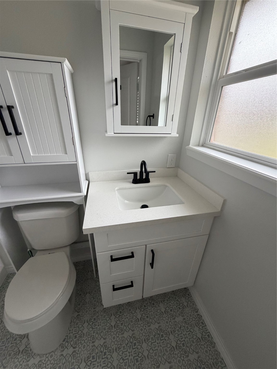 1920 Ripple Creek Drive Rosenberg, TX 77471 - Photo 23 of 26 a bathroom with a toilet sink and mirror
