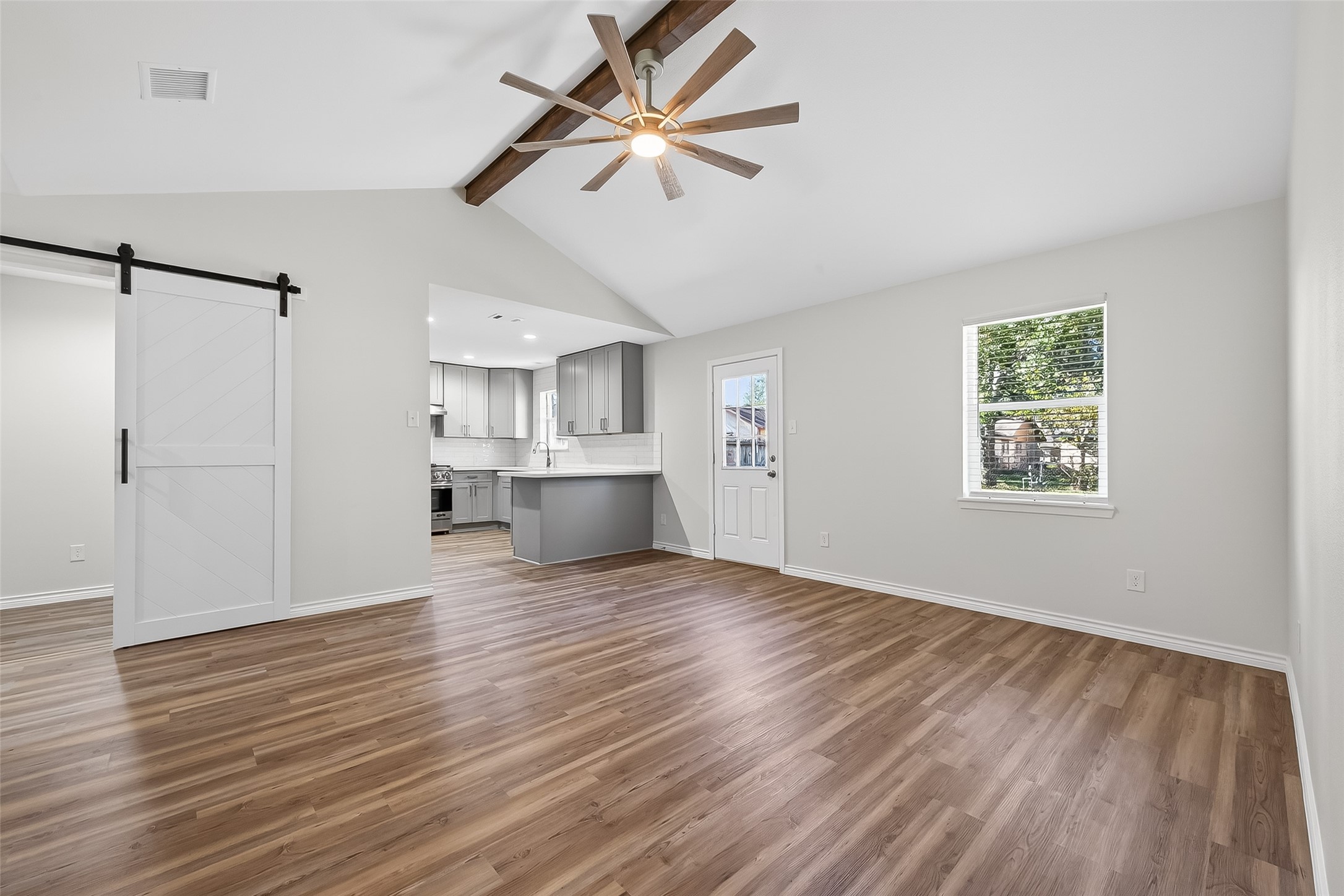 1920 Ripple Creek Drive Rosenberg, TX 77471 - Photo 4 of 26 a view of empty room with wooden floor and ceiling fan