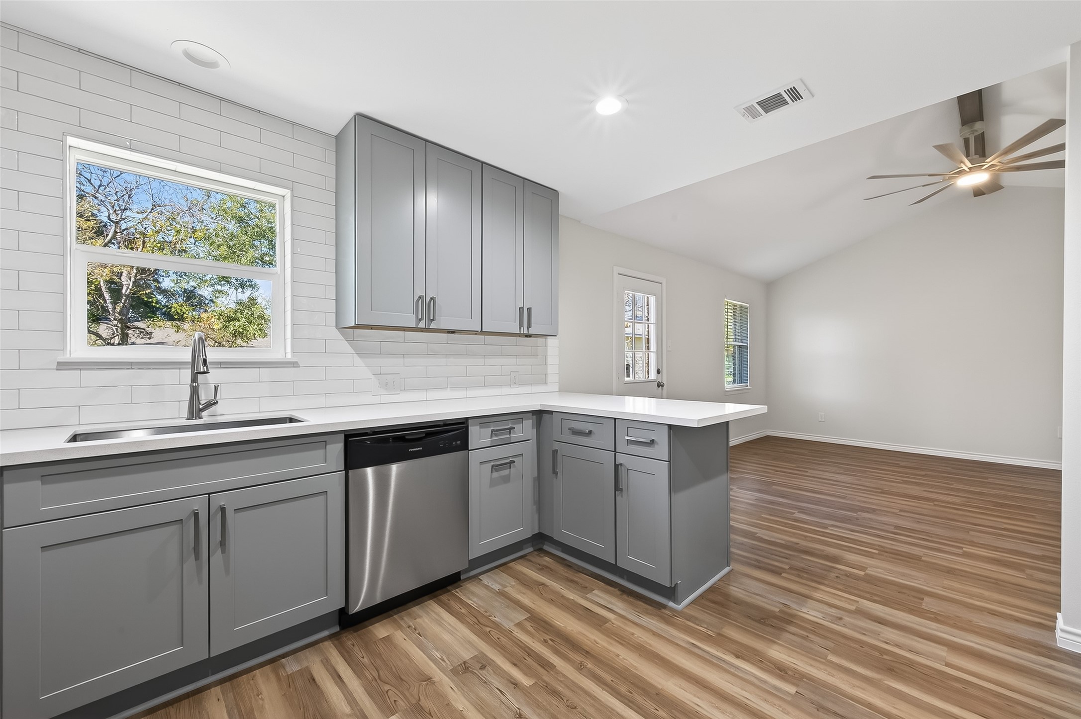 1920 Ripple Creek Drive Rosenberg, TX 77471 - Photo 10 of 26 a kitchen with a sink cabinets and window