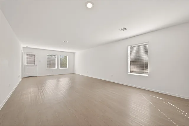 a view of empty room with windows