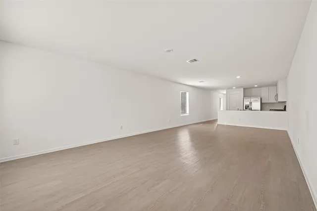 a kitchen with kitchen island granite countertop a stove and a sink