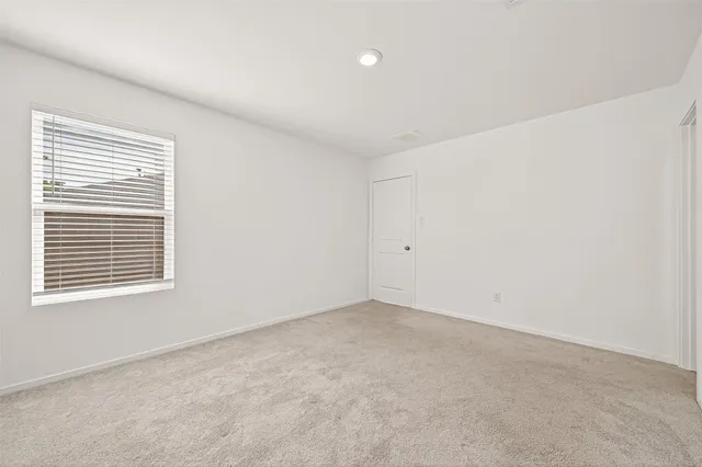 a bathroom with a shower and a sink