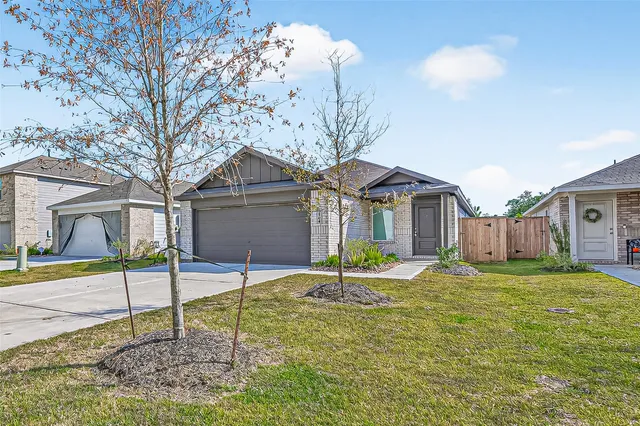a house that has a tree in front of it