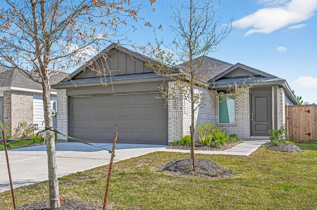 a house with trees in the background
