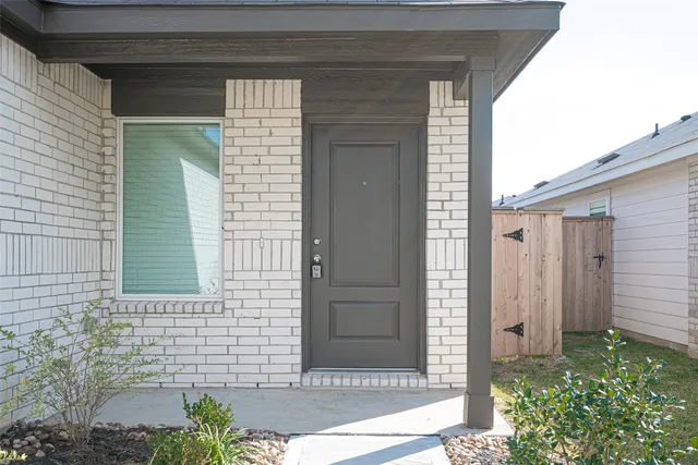 a view of a brick house with a small space