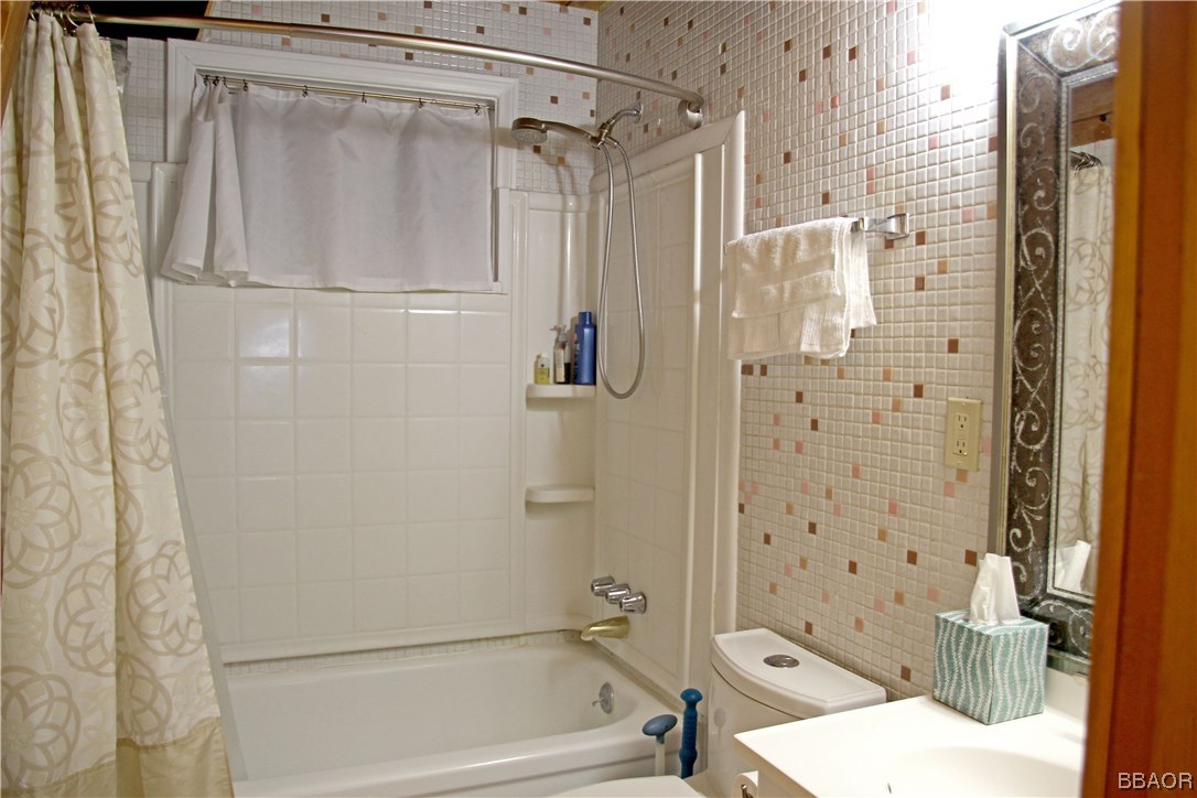 229 Pine Lane Sugarloaf, CA 92386 - Photo 13 of 24 a bathroom with a shower and a toilet