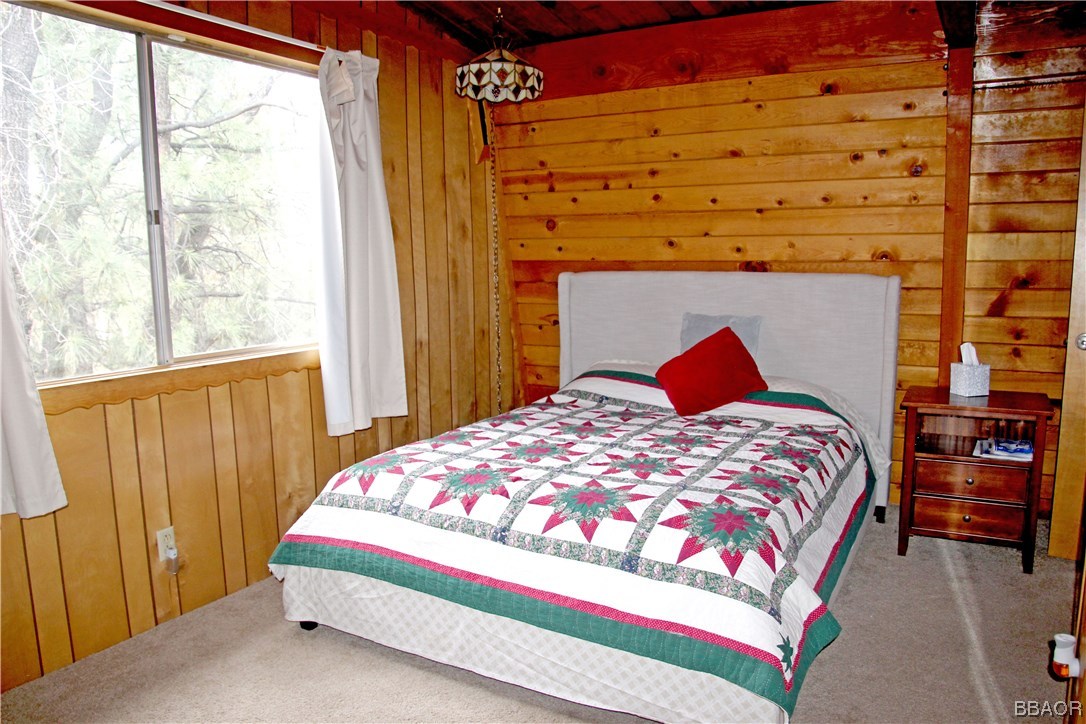 229 Pine Lane Sugarloaf, CA 92386 - Photo 14 of 24 a bedroom with a bed and a window