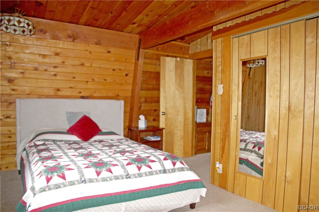 229 Pine Lane Sugarloaf, CA 92386 - Photo 15 of 24 a bedroom with a bed and a dresser