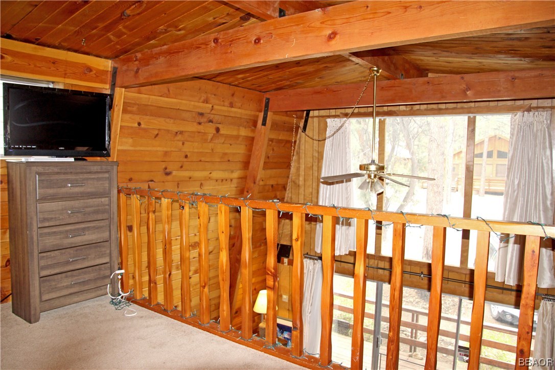 229 Pine Lane Sugarloaf, CA 92386 - Photo 17 of 24 a view of a room with wooden floor and a flat screen tv