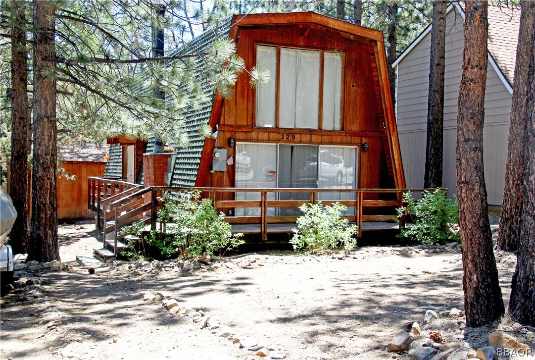 229 Pine Lane Sugarloaf, CA 92386 - Photo 2 of 24 a front view of a house with a yard