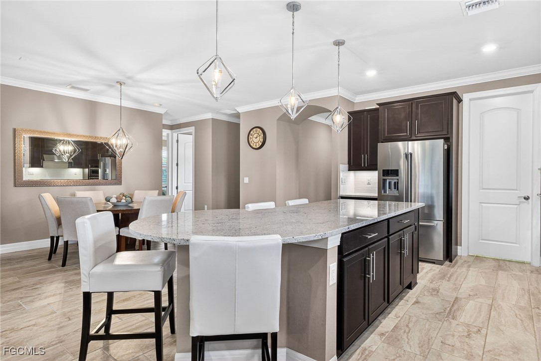 11800 Benchley Court Fort Myers, FL 33913 - Photo 1 of 50 a large kitchen with a table and chairs