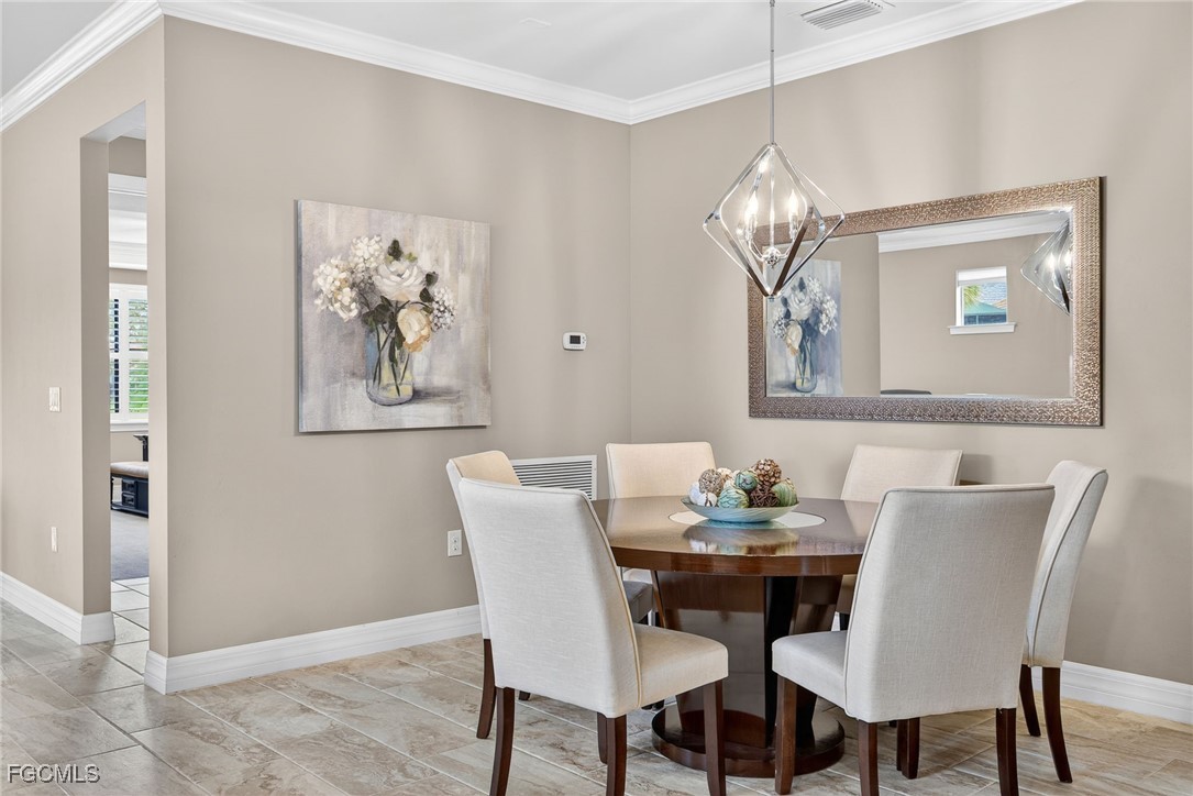 11800 Benchley Court Fort Myers, FL 33913 - Photo 14 of 50 a view of a dining room with furniture and wooden floor