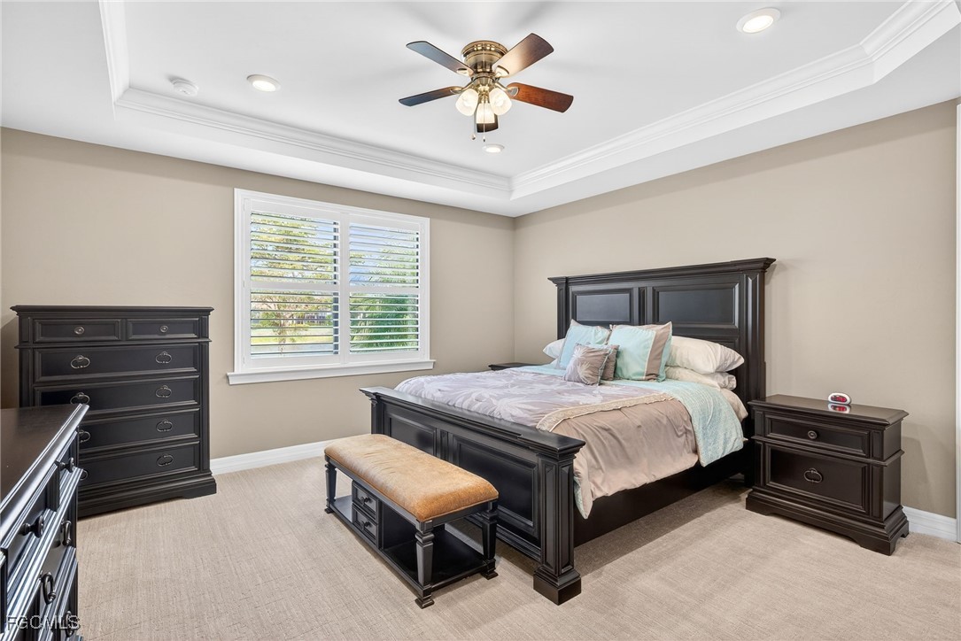 11800 Benchley Court Fort Myers, FL 33913 - Photo 15 of 50 a bedroom with a bed and a ceiling fan