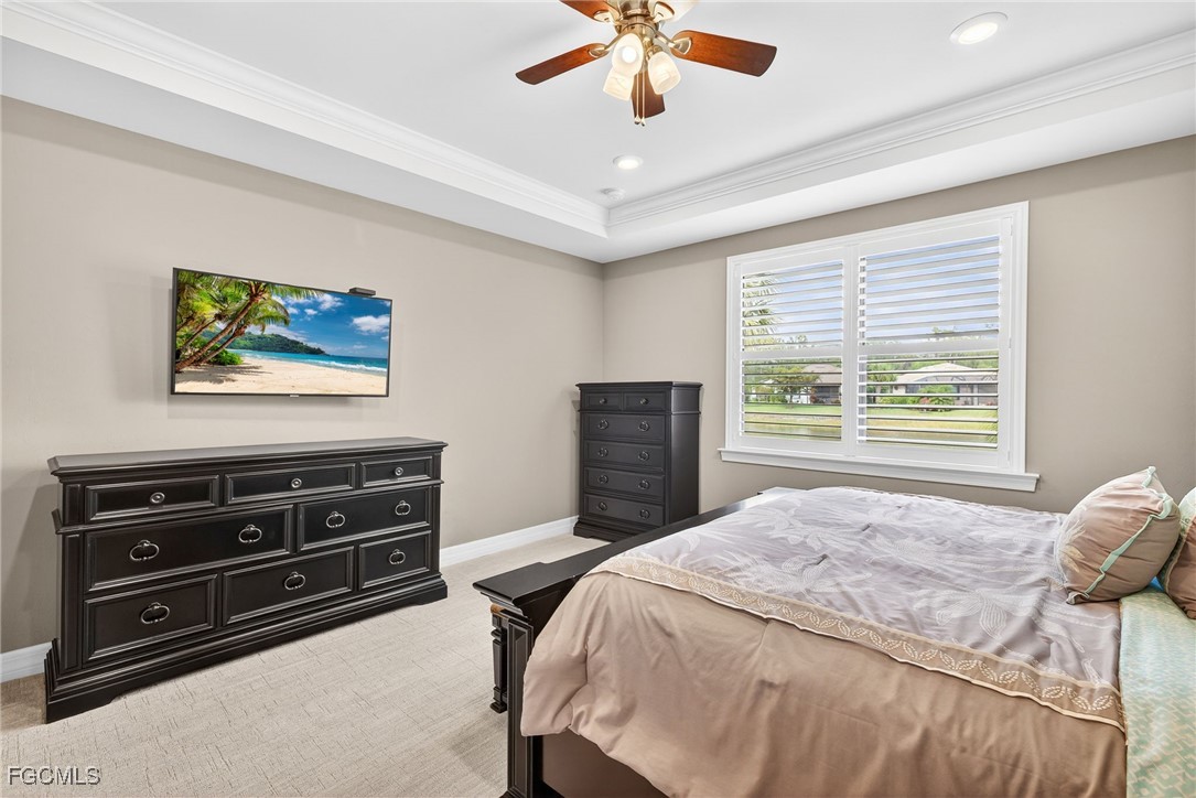 11800 Benchley Court Fort Myers, FL 33913 - Photo 16 of 50 a bedroom with a bed and a chandelier