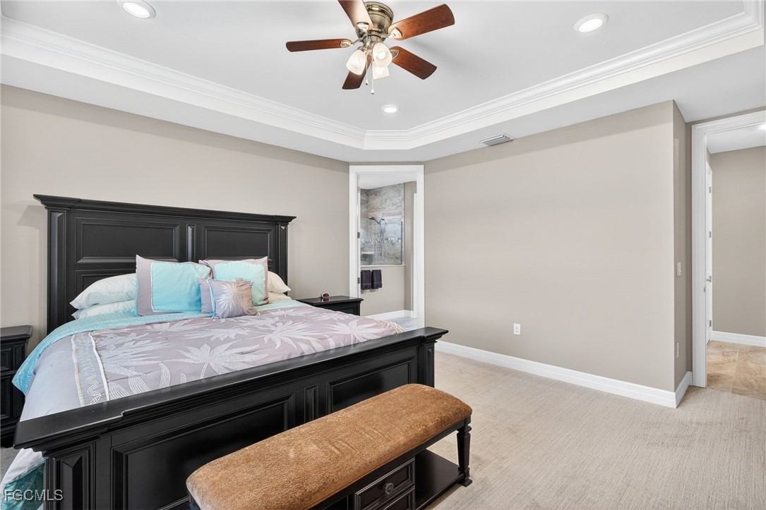 11800 Benchley Court Fort Myers, FL 33913 - Photo 17 of 50 a bedroom with a bed and a chandelier