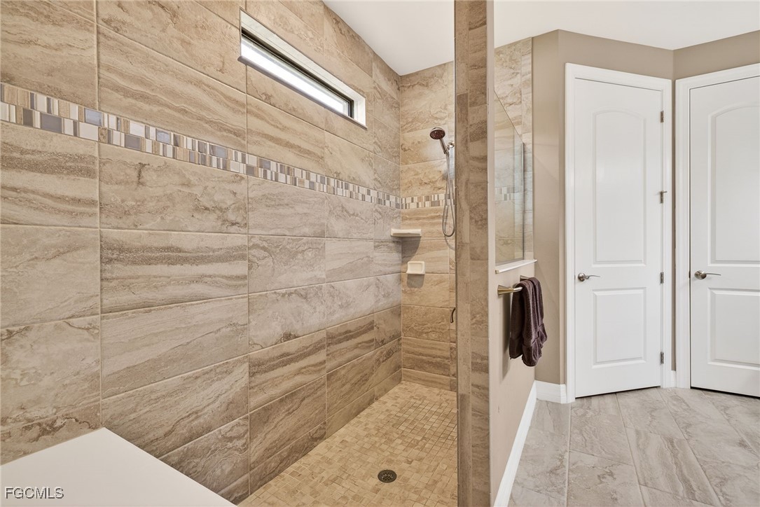 11800 Benchley Court Fort Myers, FL 33913 - Photo 19 of 50 a bathroom with a shower and toilet