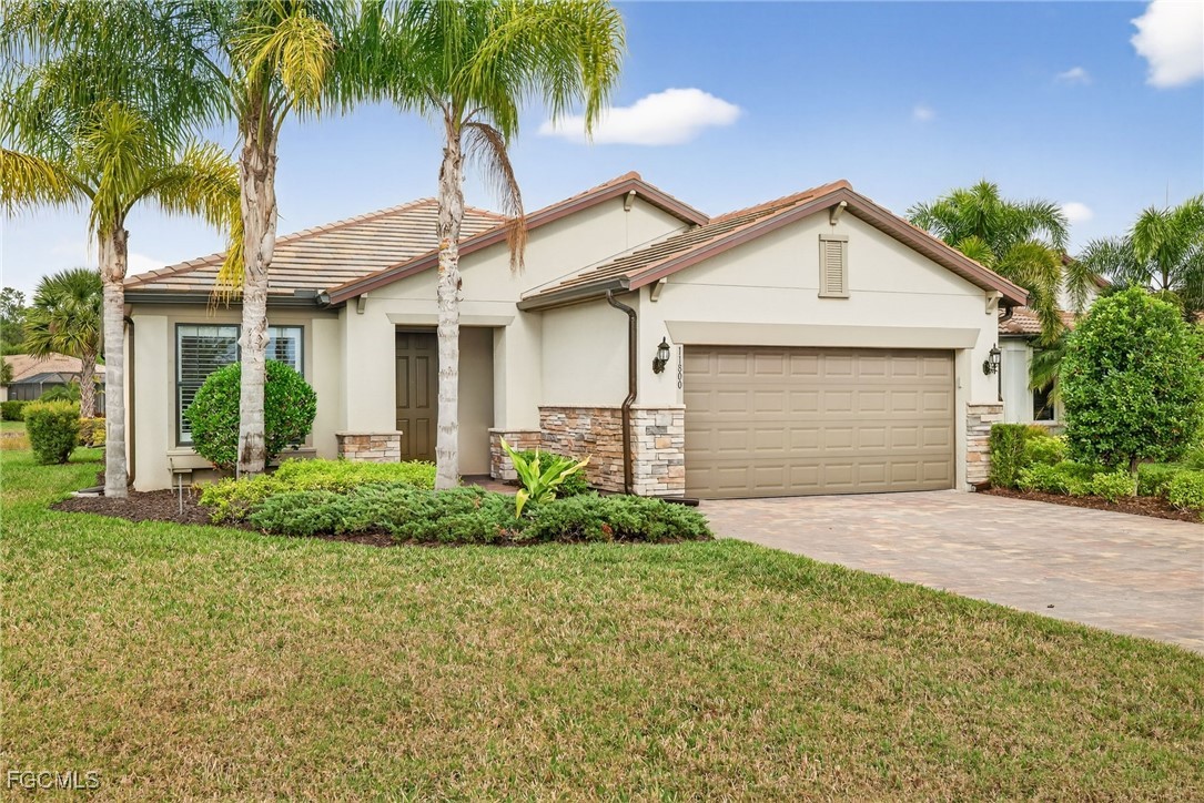 11800 Benchley Court Fort Myers, FL 33913 - Photo 2 of 50 a front view of house with yard and green space
