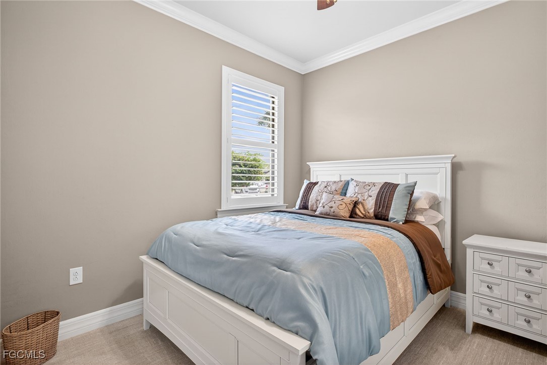 11800 Benchley Court Fort Myers, FL 33913 - Photo 22 of 50 a bedroom with a bed and a window