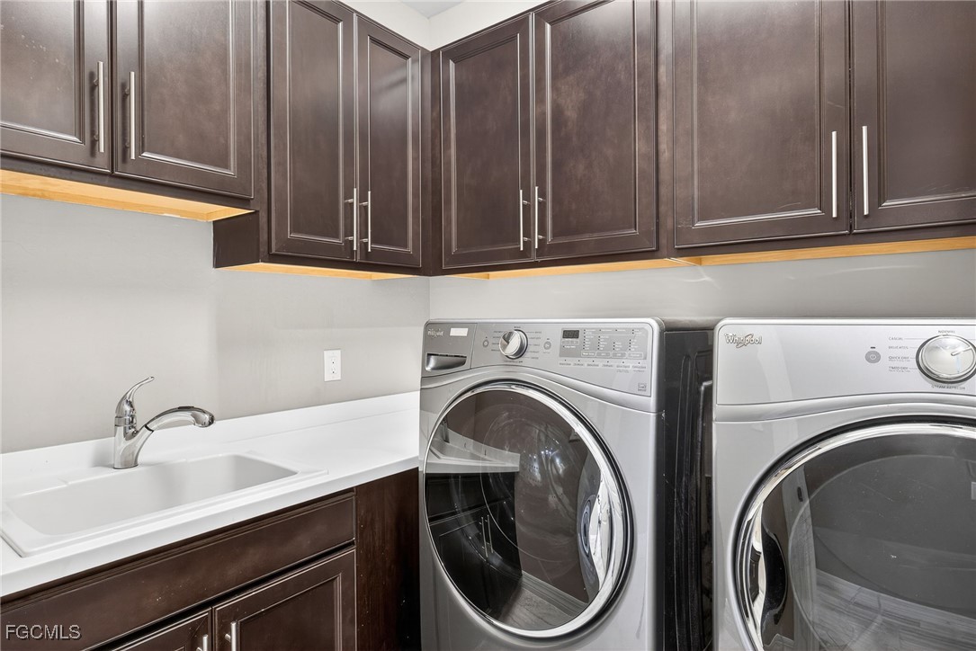 11800 Benchley Court Fort Myers, FL 33913 - Photo 25 of 50 a utility room with sink dryer and washer