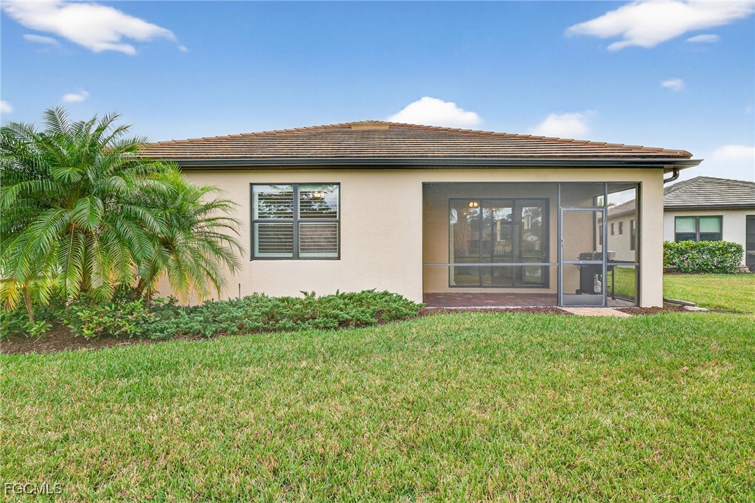 11800 Benchley Court Fort Myers, FL 33913 - Photo 28 of 50 a front view of a house with a yard