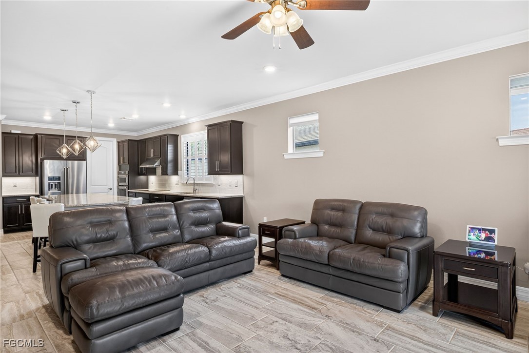 11800 Benchley Court Fort Myers, FL 33913 - Photo 7 of 50 a living room with furniture and a view of kitchen