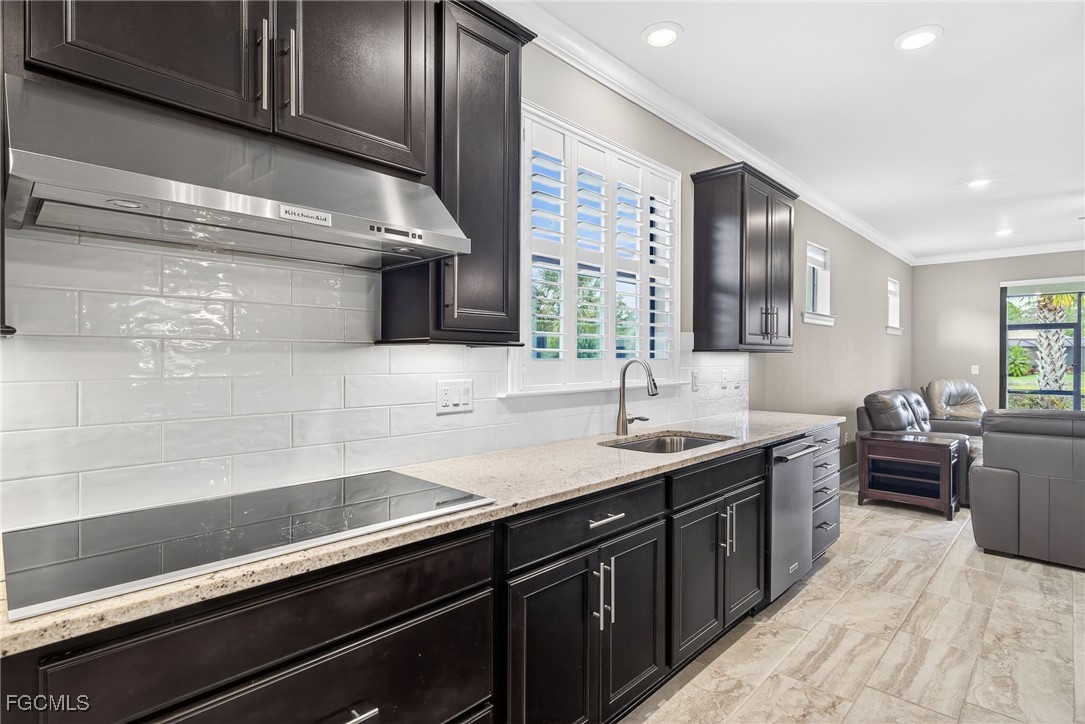 11800 Benchley Court Fort Myers, FL 33913 - Photo 10 of 50 a kitchen with a sink and stove