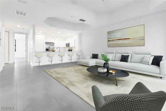 a living room with furniture and a table