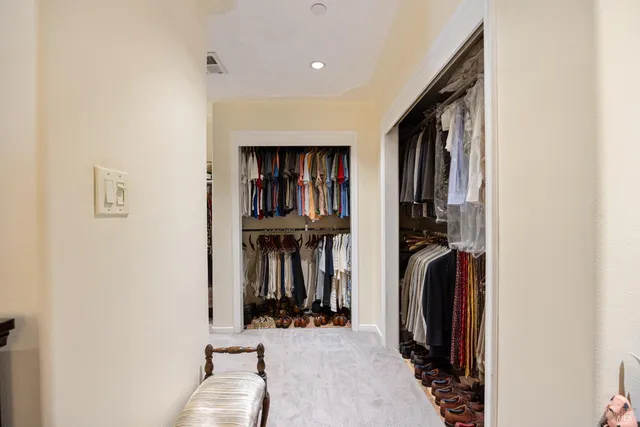 a view of a livingroom with clothes and shoes