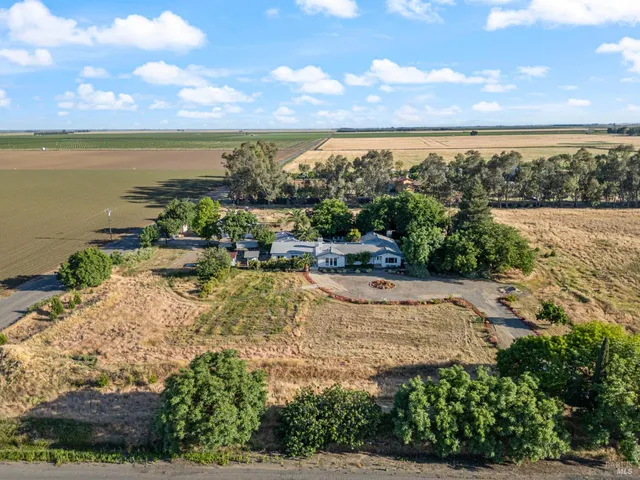 a view of a lake with a yard