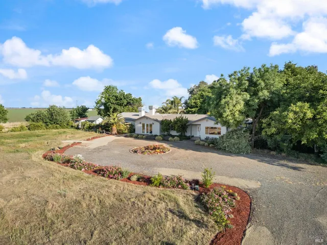 a view of a terrace with yard